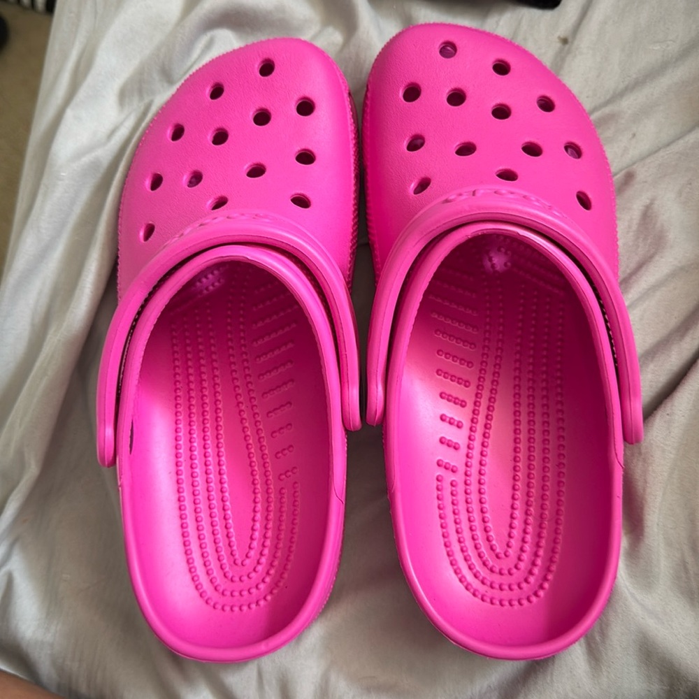 Brand new bright pink crocs.